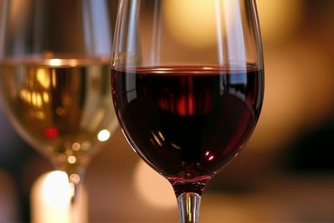 Close-up of two wine glasses on a table with soft focus background