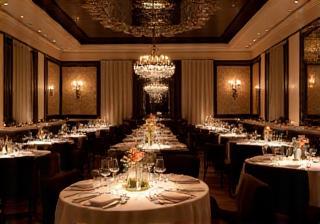Event space set up with decorated tables and ambient lighting